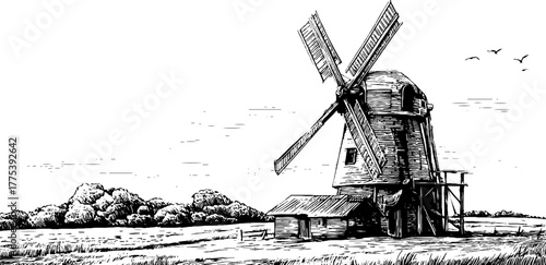 Vintage windmill with turning blades in black and white engraving style for retro design