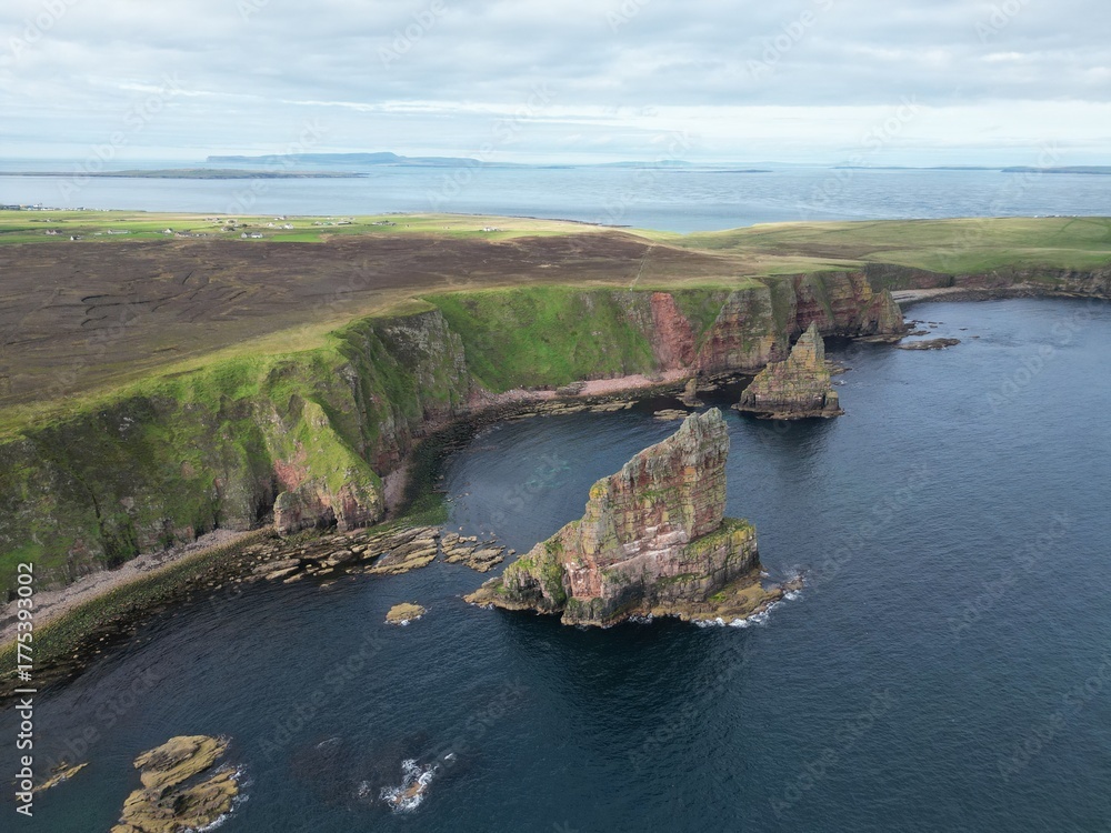 Obraz premium Drone View of the Duncansby Sea Stacks and wild and rugged coastline of Caithness in the Scottish Highlands