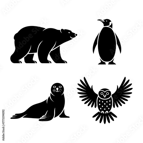 Set of polar bear, penguin standing upright, seal, and snow owl silhouettes. Vector illustration.