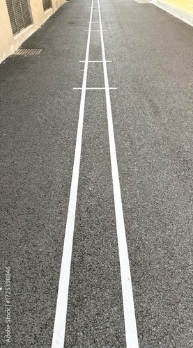 Symmetrical perspective of freshly painted road lines
