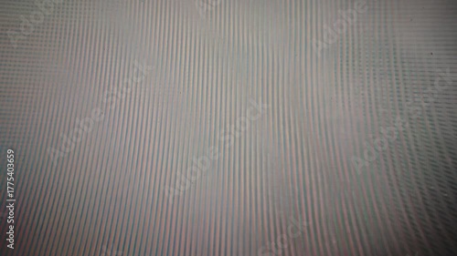 VHS glitch texture with horizontal distorted lines and pastel color bands. Retro analog video error screen from an old damaged VHS tape. Vintage noise pattern with RGB misalignment.