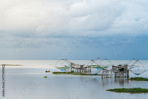 Rural lifestyle of fisherman with bamboo lift nets in the wetland.