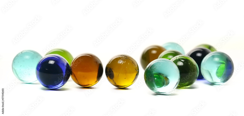 Fototapeta premium colorful marbles isolated on white background, clipping path, side view