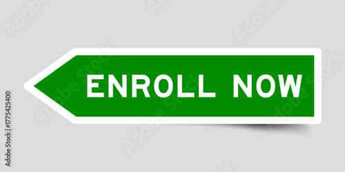 Green color arrow shape sticker label with word enroll now on gray background