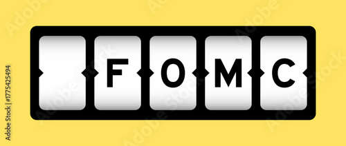 Black color in word FOMC (abbreviation of federal open market committee) on slot banner with yellow color background