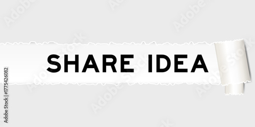 Ripped gray paper background that have word share idea under torn part