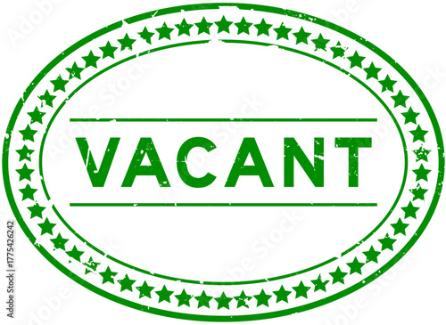 Grunge green vacant word oval rubber seal stamp on white background