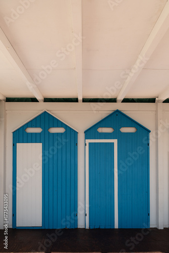 BLUE WHITE DOORS ON THE BEACH