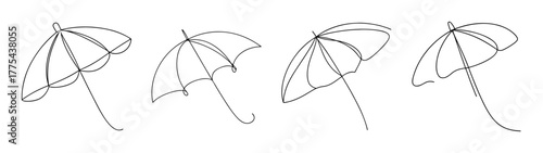 Four abstract cocktail umbrellas line up in a delightful artistic arrangement