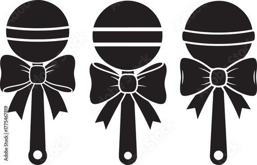 Three classic baby rattles with bows in a simple black silhouette style