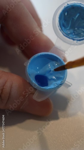 Closeup View of Woman Putting Paintbrush in Color box for Painting by Numbers. Vertical Footage