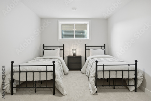 Tableau sur toile Bedroom with two twin beds and a nightstand