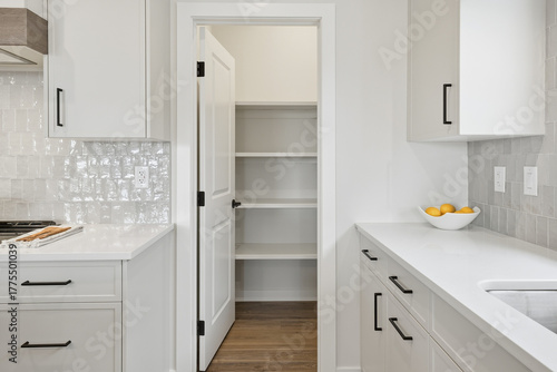 Fotografija Kitchen with a white door leading to a pantry