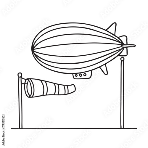 A zeppelin resting near a windsock waving in the wind