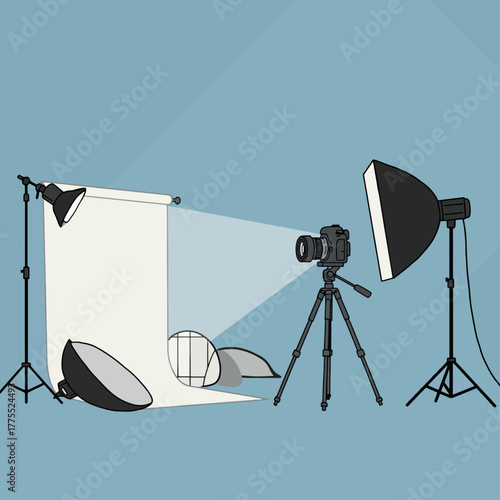 Professional photography studio setup with camera, tripod, various lights, and a white backdrop for photoshoots.