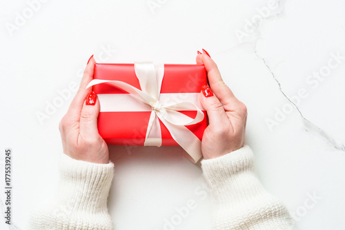 Woman giving Christmas pres...