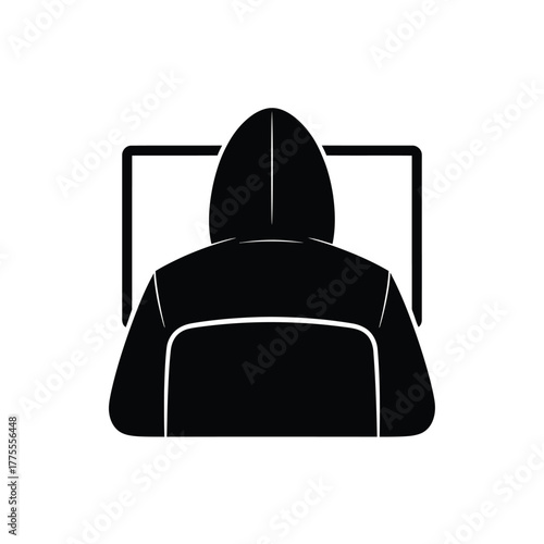 Anonymous hacker in a hoodie working on a computer screen