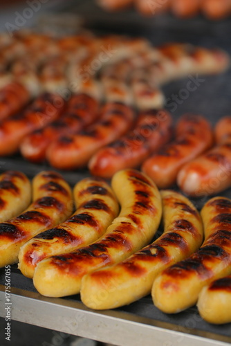Grilling sausages on the grill with flames and smoke. food tasty sausadges, Sausage grilled to perfection on Barbeque.