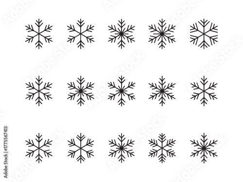 Frozen Patterns: A serene collection of delicate snowflakes, each showcasing intricate symmetry and icy beauty. The scene captures the ephemeral elegance of winter and the intricate designs of nature.