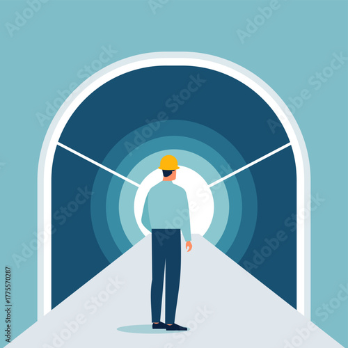 Professional civil engineer worker on road to tunnel entrance. Construction site inspection, infrastructure development and underground earthworks or safety maintenance for the transportation industry
