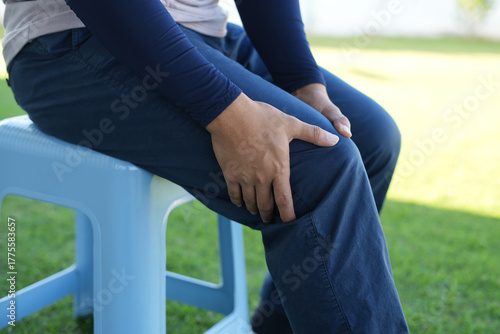 Man athlete gets pain after exercise and It happens often in athletes over practice. Sport and traumas concept and a jogger running and feeling acute pain in knee and ankle and massaging to get relief