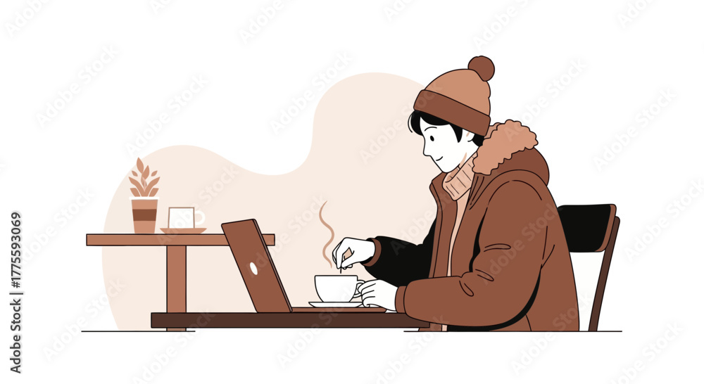 Fototapeta premium A Person Enjoys Coffee While Working on Their Laptop at a Cafe in Wintertime
