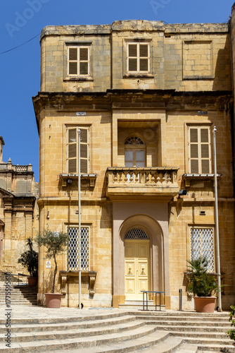 Old, typical limestone tenement house in Malta