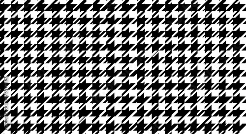 A classic black and white houndstooth pattern, a timeless textile design.