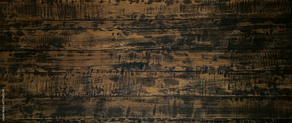 Obraz premium Old grunge dark textured wooden background with deep. rich brown tones, surface of aged wood, featuring prominent grain patterns, cracks, scratches, weathered imperfections.