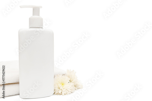 White plastic container with white towel and white flowers on white background.
