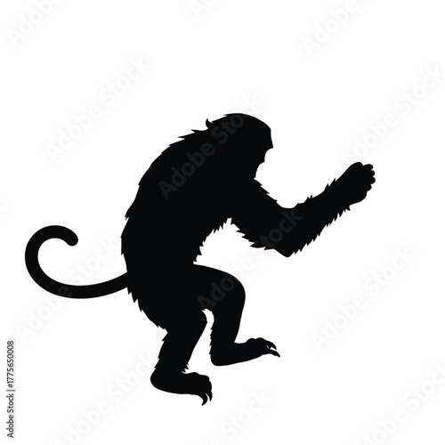 Adobe Illustrator Artwork : A stark black silhouette of a monkey in a defensive or attacking stance, captured mid-motion, evoking agility, wildness, and primal energy.