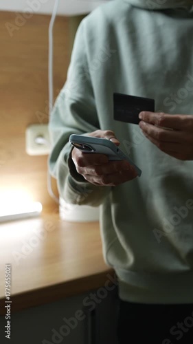 A person enters bank card information to transfer money and pay for purchases.
Financial transactions.
Monetary transactions and budget allocation.
Economics, finance, utilities, shopping