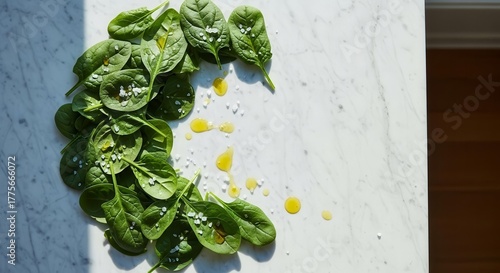Fresh Spinach Leaves Arranged with Olive Oil and Salt on Textured White Marble Surface