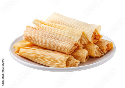 Stacked tamales on a white plate