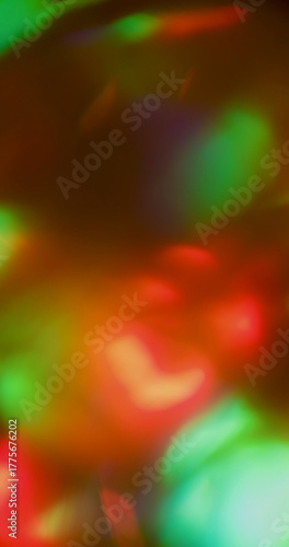 Film blur burn. Light leak. Red orange green beam on dark background. Abstract flare spot glowing color vintage luminosity flame texture.