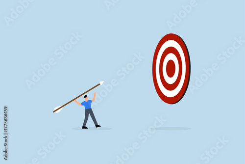 Aiming for big goal, entrepreneur launching large dart, targeting bullseye of dartboard.