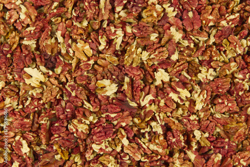 Red kernels of shelled walnuts dried after the autumn harvest 