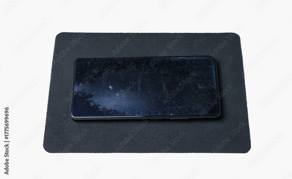 Fototapeta premium A smartphone with a badly worn screen protector.