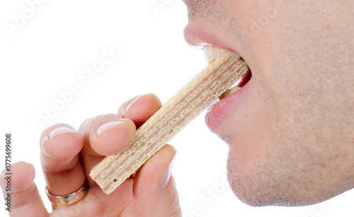 Tableau sur toile Man eating wafer biscuit