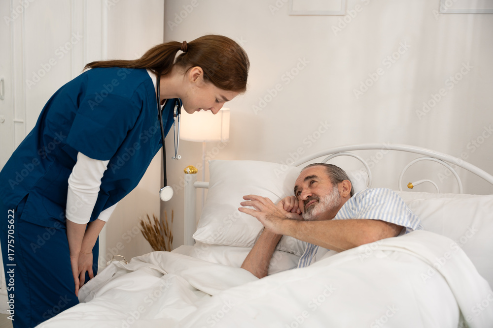 Obraz premium Man being cared for by a private nurse at home suffering from Alzheimer's disease to closely care for elderly patients