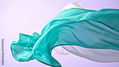 Flowing Teal and White Fabric Against a Soft Purple Background.
