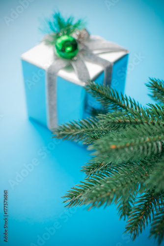 Wallpaper Mural Festive Silver Gift Box with Pine Branch on Vibrant Blue Background Torontodigital.ca