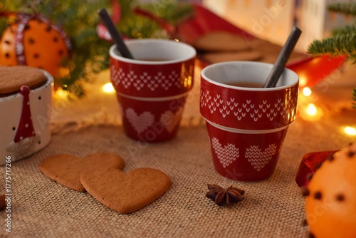 Mulled wine in a small red mugs and Swedish gingerbread,Pepparkakor. Time to drink mulled wine.