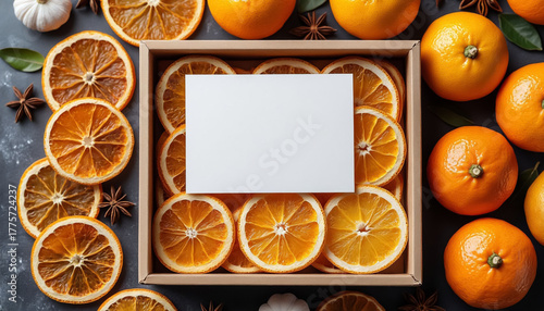 Eco-friendly present box with orange slices and blank card.