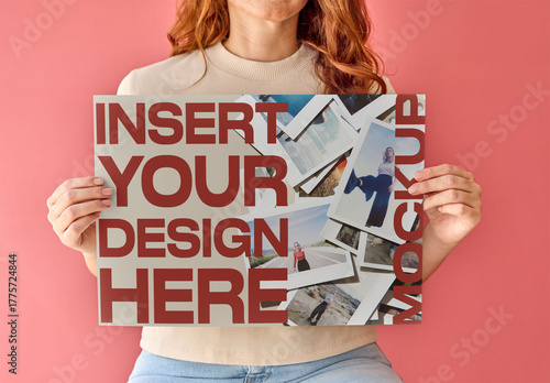 Horizontal Poster Design Mockup. A woman holds a blank poster in front of a pink background. 