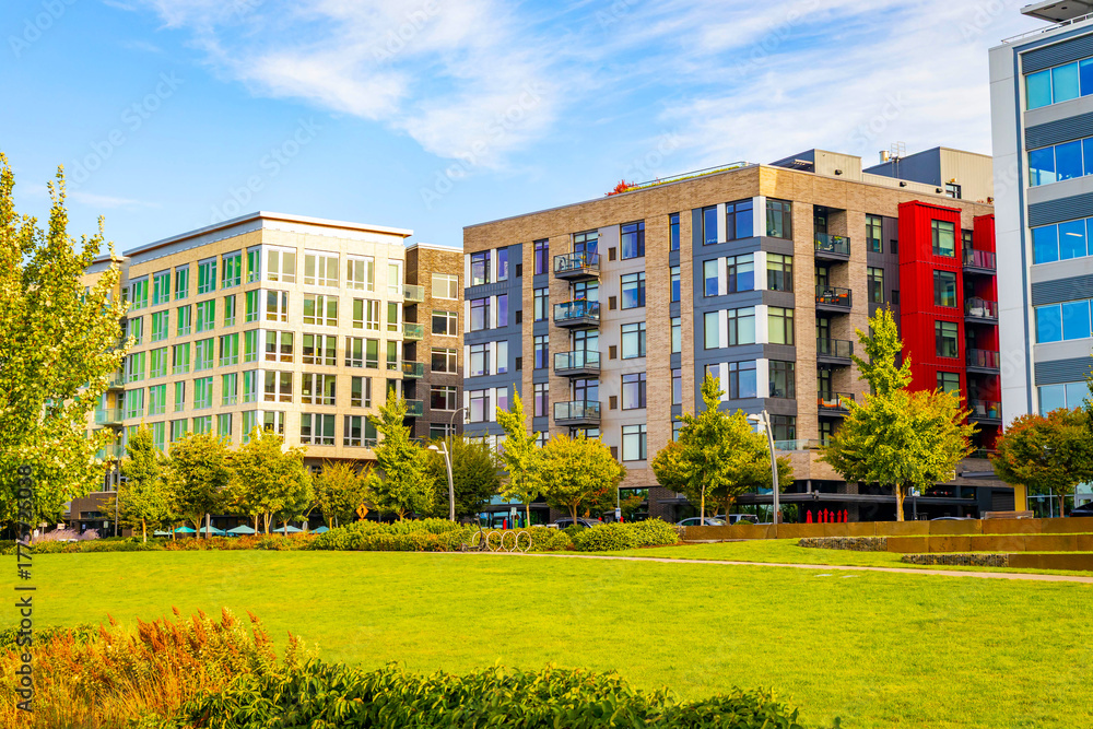 Fototapeta premium Modern Downtown Streetscape Featuring Mixed-Use Residential and Office Buildings.