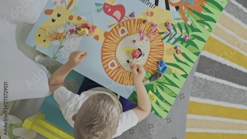 Toddler creating animals with modeling clay at home