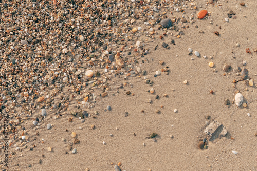 Fototapeta Naklejka Na Ścianę i Meble -  Pebbles at the sandy beach in summer