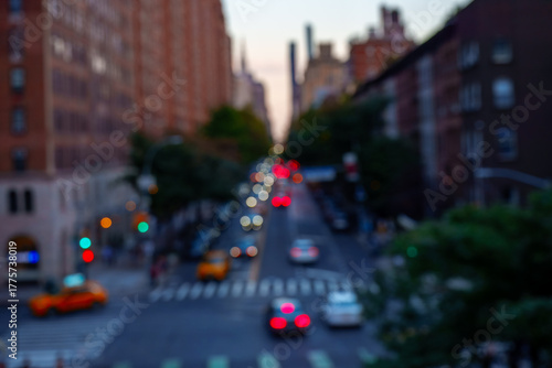 Blurred headlights from cars driving through Midtown Manhattan in New York City in night.