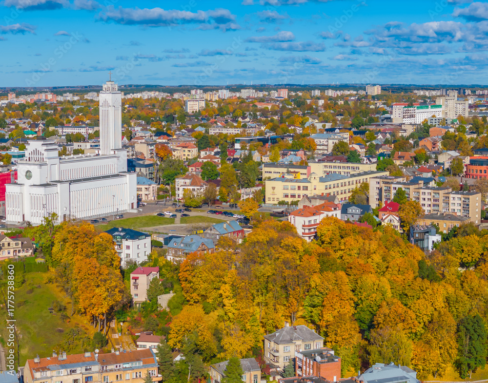 Fototapeta premium Christ's Resurrection Church in Kaunas, Lithuania, Zaliakalnis district. Aerial drone view photo of Kaunas golden autumn